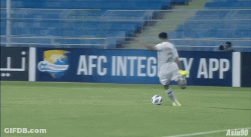 A Soccer Player Is Kicking A Ball In Front Of An Afc Integrity App Sign GIF