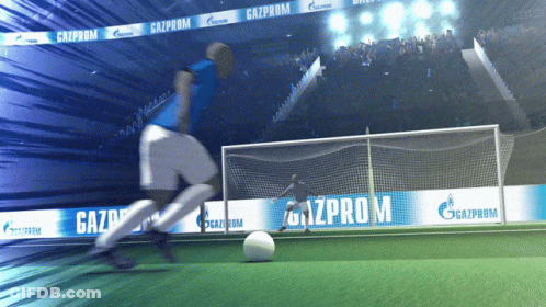 A Soccer Player Is Kicking A Ball On A Field With Gazprom Banners Behind Him GIF