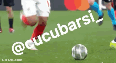 A Soccer Player Is Kicking A Ball On A Field With The Words @Cucubarsi_ On It GIF