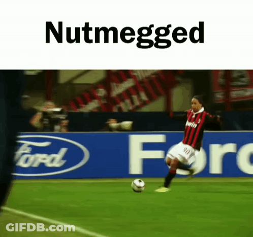 A Soccer Player Is Kicking A Soccer Ball In Front Of A Ford Banner GIF