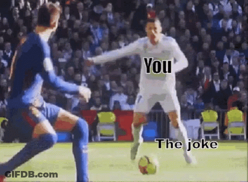 A Soccer Player Is Kicking A Soccer Ball While Another Player Tries To Block Him . GIF