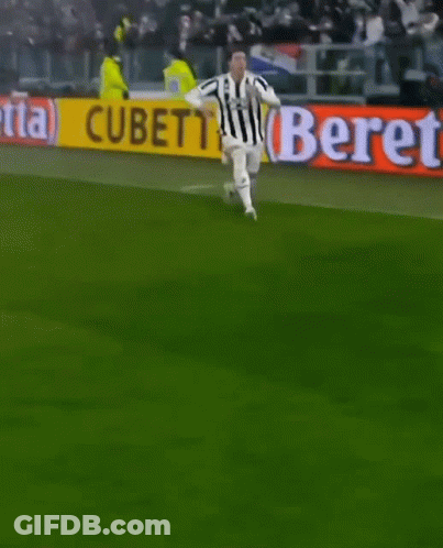 A Soccer Player Is Kneeling On The Field In Front Of A Beretta Banner GIF