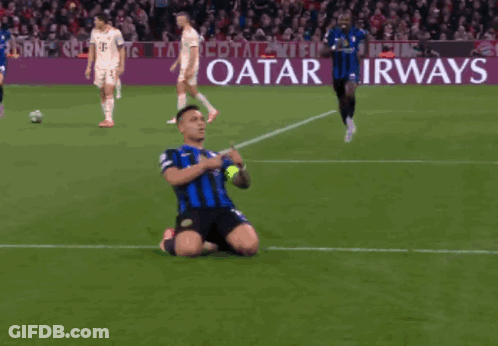 A Soccer Player Is Kneeling On The Field In Front Of A Qatar Airways Banner GIF