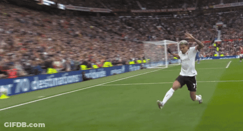 A Soccer Player Is Kneeling On The Field In Front Of A Sign That Says " Fly To Over 70 Destinations " GIF