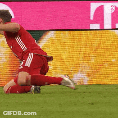 A Soccer Player Is Kneeling On The Field In Front Of A T Mobile Sign GIF
