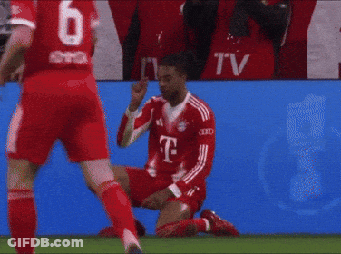 A Soccer Player Is Kneeling On The Field With His Head In His Hand GIF