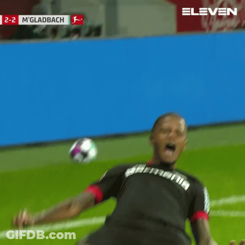 A Soccer Player Is Kneeling On The Field With The Score 2-2 In The Background GIF