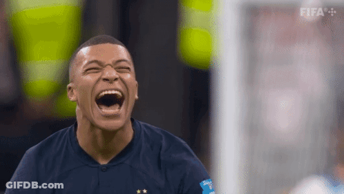 A Soccer Player Is Laughing While Wearing A Blue Shirt With Fifa Written On It GIF