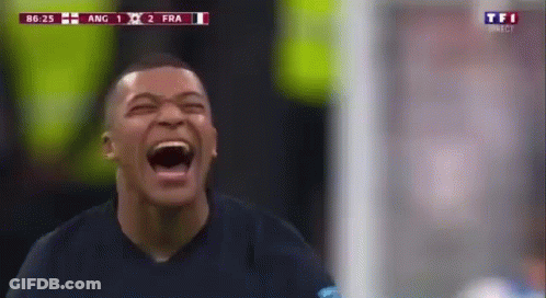 A Soccer Player Is Laughing With His Mouth Open During A Soccer Match . GIF