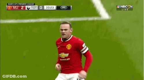 A Soccer Player Is Laying On The Field While Another Player Kicks Him In The Face GIF