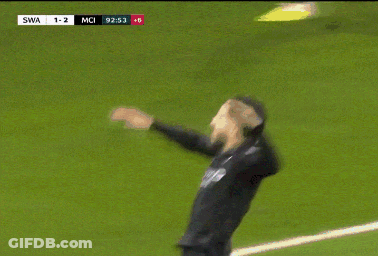 A Soccer Player Is Laying On The Field With The Score 1-2 GIF