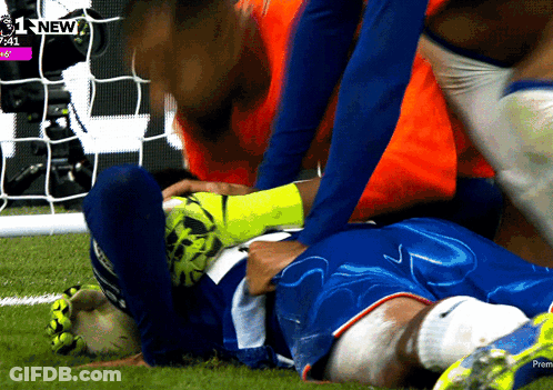 A Soccer Player Is Laying On The Field With The Time 7:41 On The Screen Behind Him GIF