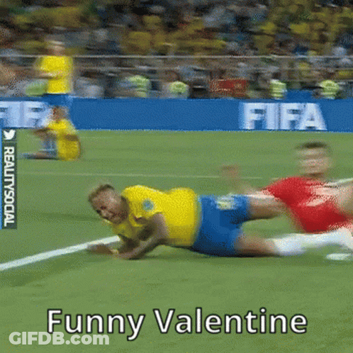 A Soccer Player Is Laying On The Field With The Words Funny Valentine Below Him GIF