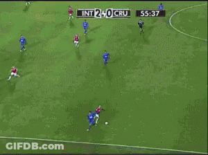 A Soccer Player Is Laying On The Ground In Front Of A Unimed Banner GIF