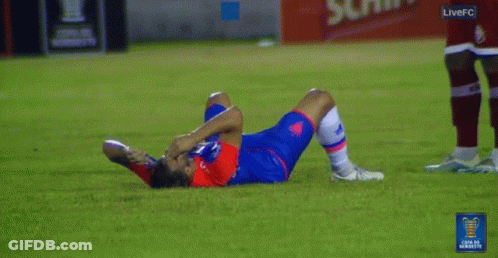 A Soccer Player Is Laying On The Ground With A Live Fc Logo In The Corner GIF
