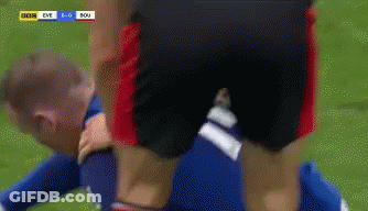 A Soccer Player Is Laying On The Ground With The Score Being 1-0 GIF