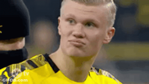 A Soccer Player Is Making A Funny Face While Wearing A Yellow Shirt . GIF