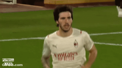 A Soccer Player Is Running On A Field With The Words Futball Karim Behind Him GIF