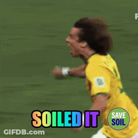 A Soccer Player Is Running On A Field With The Words " Soiled It " Behind Him GIF