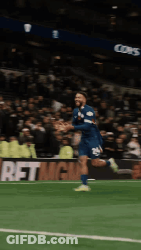 A Soccer Player Is Running On The Field In Front Of A Sign That Says Betmgmt GIF