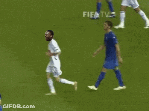 A Soccer Player Is Running On The Field With A Fifa Tv Advertisement In The Background GIF