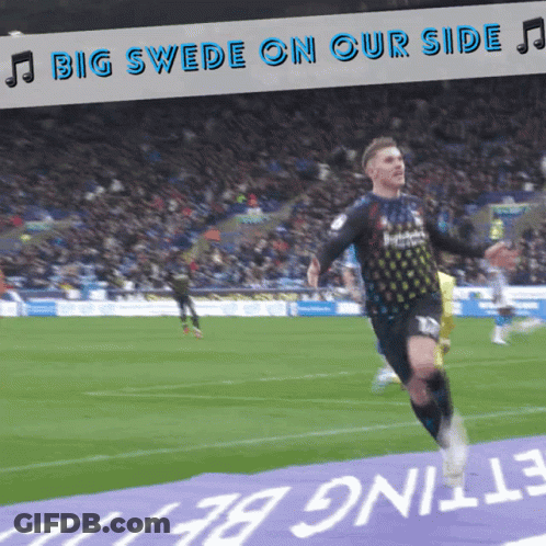 A Soccer Player Is Running On The Field With The Words Big Swede On Our Side Behind Him GIF