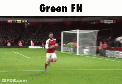 A Soccer Player Is Running On The Field With The Words Green Fn Written Above Him GIF