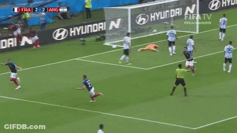 A Soccer Player Is Running Towards A Goal During A Game . GIF
