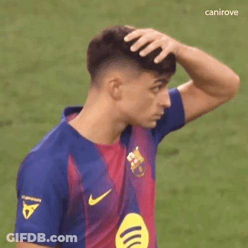 A Soccer Player Is Scratching His Head With His Hand While Wearing A Nike Jersey . GIF