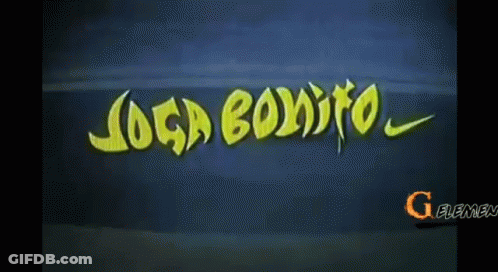 A Soccer Player Is Sitting On The Field Wearing A Yellow Jersey With The Letter G On The Sleeve GIF