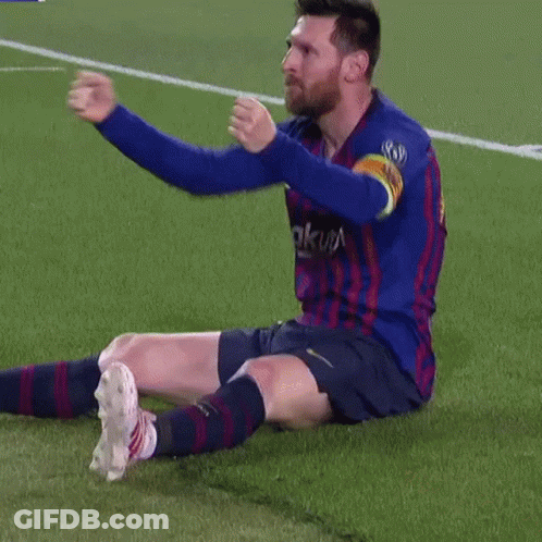 A Soccer Player Is Sitting On The Field With His Arms Outstretched GIF