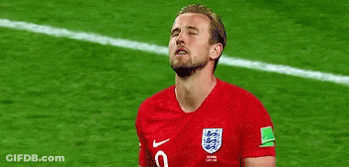 A Soccer Player Is Standing On A Field With His Eyes Closed And His Mouth Open . GIF