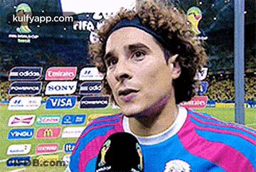 A Soccer Player Is Talking Into A Microphone While Wearing A Headband Sponsored By Visa And Sony GIF