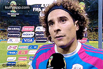 A Soccer Player Is Talking Into A Microphone While Wearing A Headband Sponsored By Visa GIF