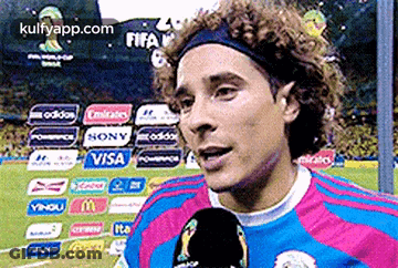 A Soccer Player Is Talking Into A Microphone While Wearing A Headband Sponsored By Visa GIF
