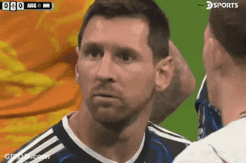 A Soccer Player Is Talking To Another Player With A Sports Logo In The Corner GIF