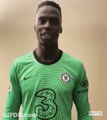 A Soccer Player Is Wearing A Green Jersey With A 3 On It . GIF