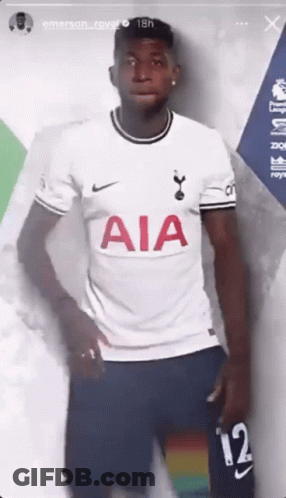 A Soccer Player Is Wearing A White Aia Jersey And Blue Shorts . GIF