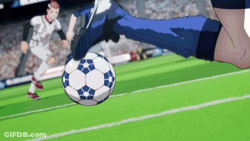 A Soccer Player Kicking A Ball On A Field With A Crowd In The Background GIF