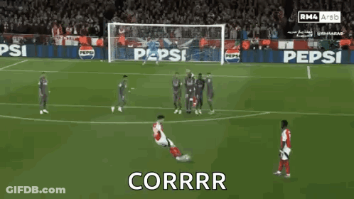 A Soccer Player Kicking A Ball With The Word Corrr Written Below Him GIF