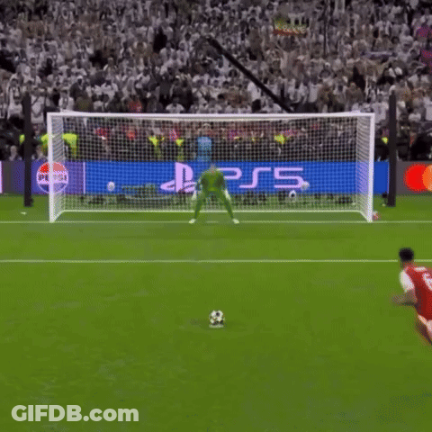 A Soccer Player Kicks A Ball In Front Of A Ps5 Banner GIF