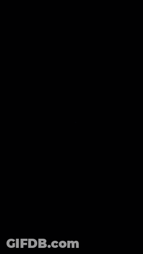 A Soccer Player Kicks A Ball While Another Player Tries To Block It GIF