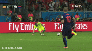 A Soccer Player Kicks The Ball In Front Of A Fly Emirates Advertisement GIF