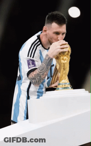 A Soccer Player Kisses A Trophy With The Number 8 On It GIF