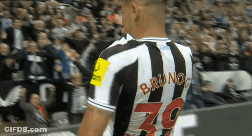 A Soccer Player Named Bruno Is Wearing A Black And White Striped Jersey GIF