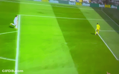 A Soccer Player Runs Towards A Goal With A Banner Behind Him That Says Betsson.com GIF