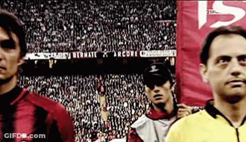 A Soccer Player Stands In Front Of A Banner That Says Bernate On It GIF