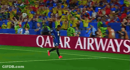 A Soccer Player Stands In Front Of A Lenovo Ad GIF