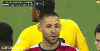 A Soccer Player Stands In Front Of A Scoreboard That Says Fifa World Cup Qualifier On It GIF