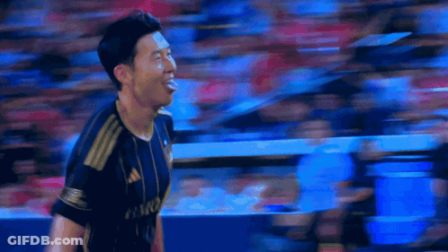 A Soccer Player Stands In Front Of A Scoreboard That Says Lafc GIF